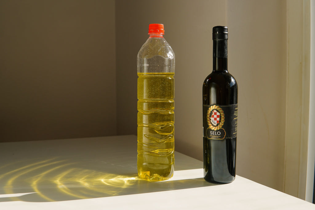 Low quality plastic bottle of olive oil